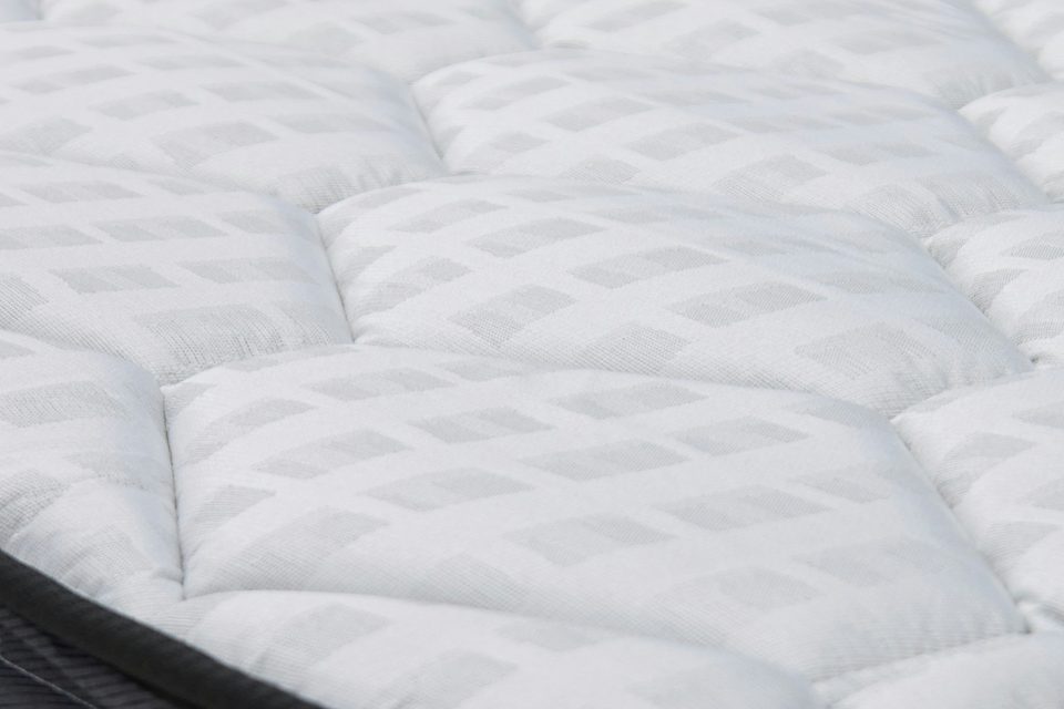 Surmatelas capitonné blanc