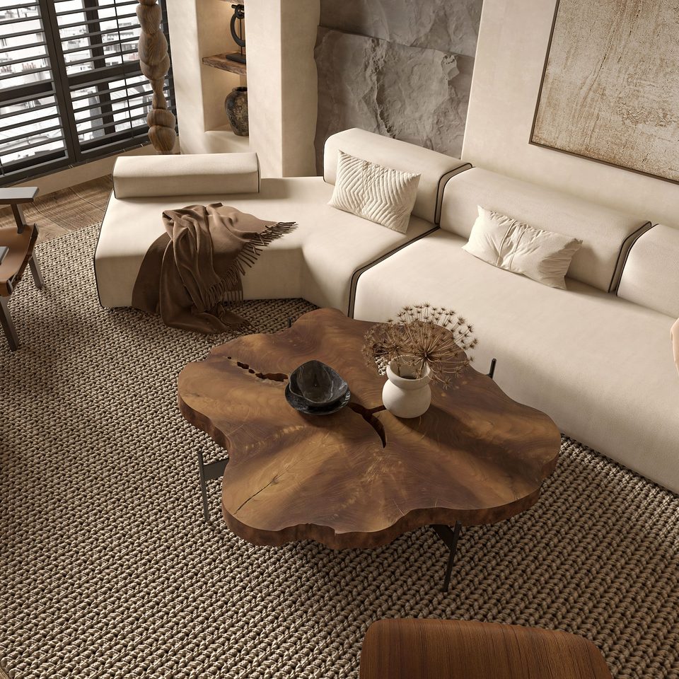Salon aux tons clairs, tapis tressé sous une table en bois